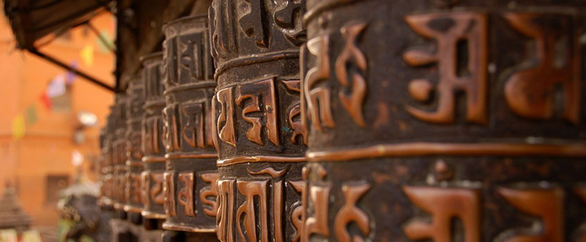 Tibetans turn prayer wheels to send wishes out into the world